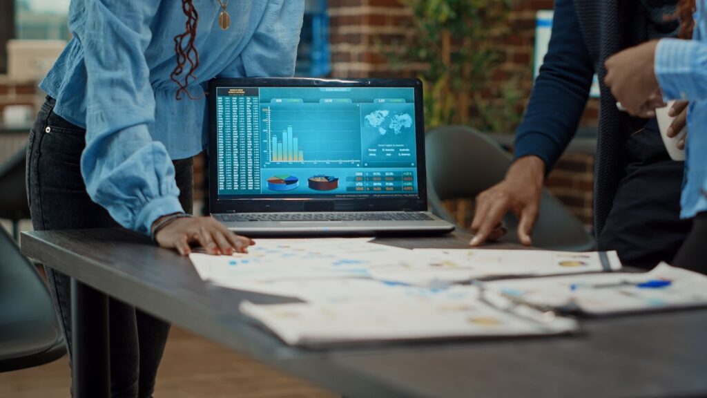 Business team analyzing dashboard reports during a meeting